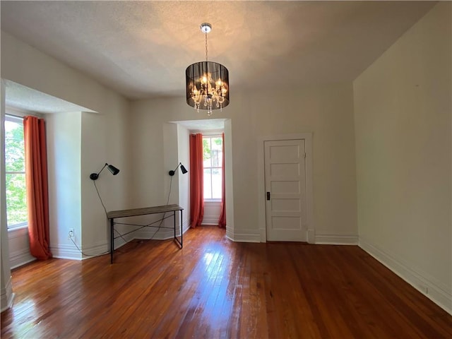 112 Kilmarnock St, Mobile, AL 36604 - foyer entrance featuring plenty of natural light, wood finished floors, a chandelier, and baseboards