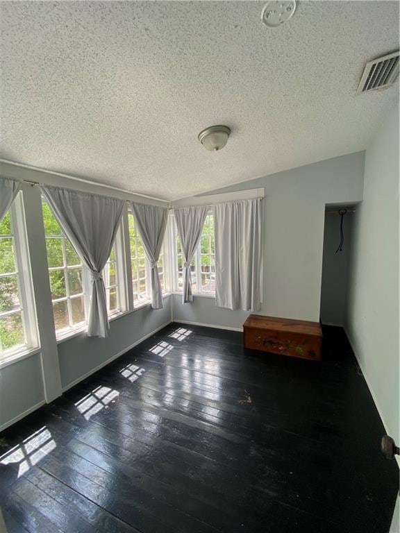 112 Kilmarnock St, Mobile, AL 36604 - unfurnished room featuring wood-type flooring, a textured ceiling, and baseboards