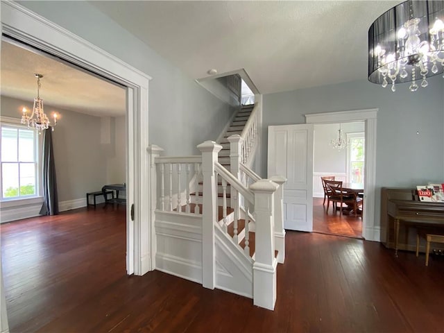 112 Kilmarnock St, Mobile, AL 36604 - staircase with a chandelier and wood-type flooring