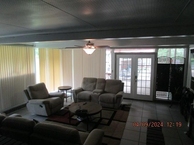 living room with ceiling fan, french doors, and tile patterned flooring