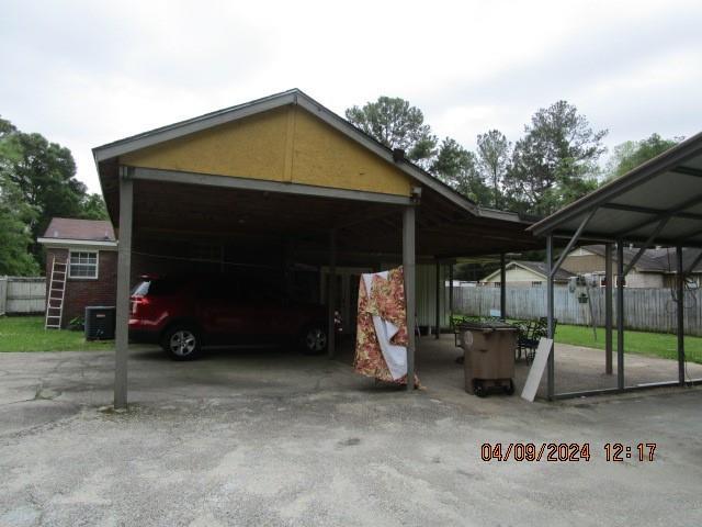 exterior space featuring a carport