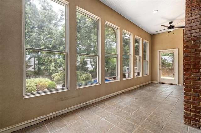 2605 Charleston Oaks Dr W, Mobile, AL 36695 - unfurnished sunroom with tile patterned flooring and baseboards