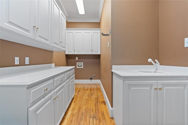 2605 Charleston Oaks Dr W, Mobile, AL 36695 - washroom with washer hookup, cabinet space, light wood-type flooring, and ornamental molding