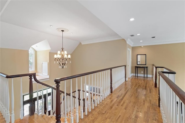 2605 Charleston Oaks Dr W, Mobile, AL 36695 - corridor featuring a chandelier, light wood finished floors, an upstairs landing, crown molding, and recessed lighting