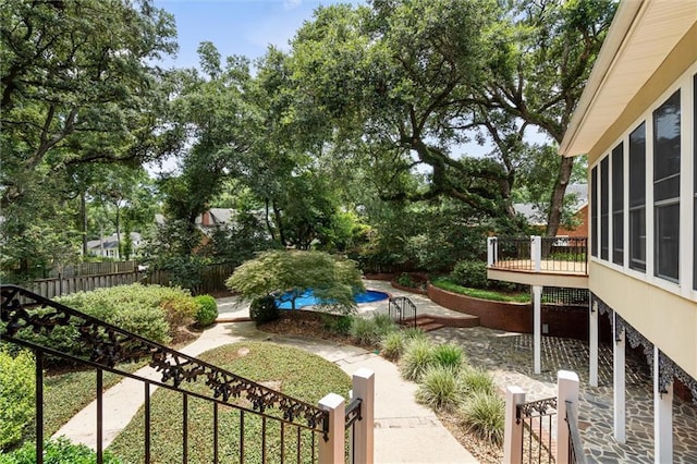 2605 Charleston Oaks Dr W, Mobile, AL 36695 - view of yard with a deck and view of scattered trees