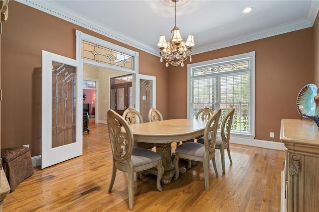 2605 Charleston Oaks Dr W, Mobile, AL 36695 - dining area featuring french doors, a chandelier, ornamental molding, and light wood finished floors