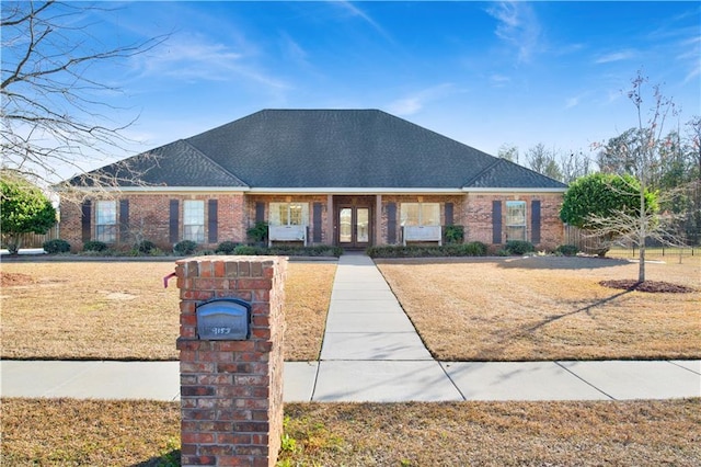 ranch-style house featuring a front lawn