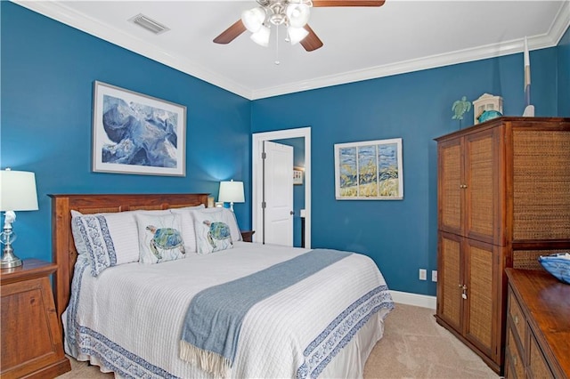 carpeted bedroom with ceiling fan and ornamental molding