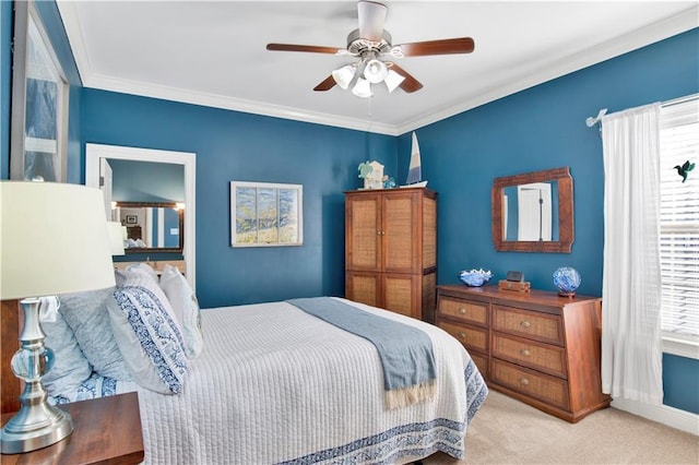 bedroom featuring light carpet, multiple windows, ceiling fan, and crown molding