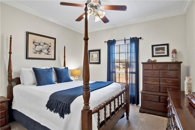 carpeted bedroom with ceiling fan and ornamental molding