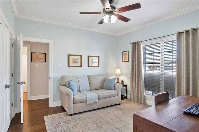 living room featuring dark hardwood / wood-style flooring, ceiling fan, and ornamental molding