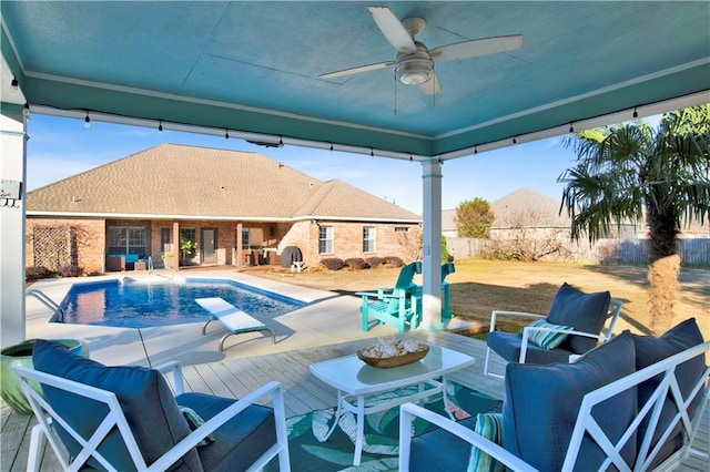 view of swimming pool featuring ceiling fan