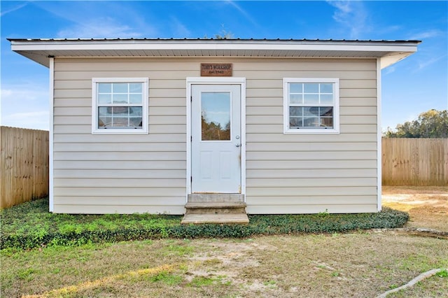 view of outbuilding featuring a yard