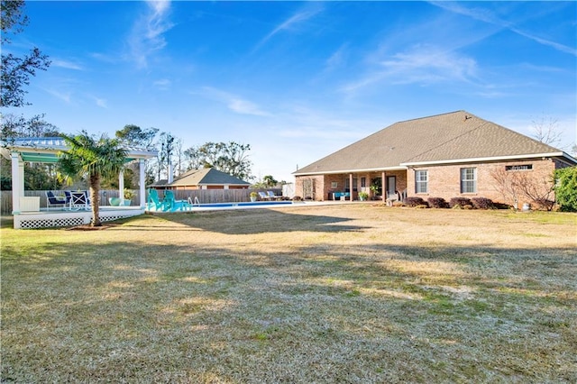 view of yard with a swimming pool side deck