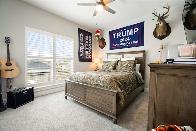 bedroom with multiple windows, carpet, and ceiling fan