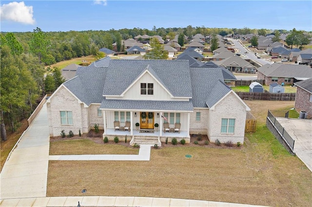 view of front of home featuring a porch and a front yard