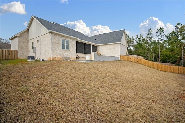 rear view of property featuring central AC unit