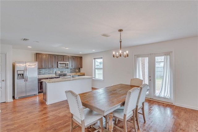 3473 Summer Woods Cir W, Mobile, AL 36695 - dining area featuring a chandelier, light wood-style floors, baseboards, and recessed lighting