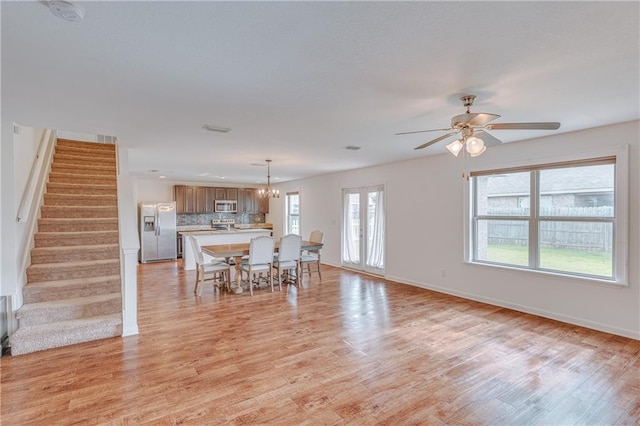 3473 Summer Woods Cir W, Mobile, AL 36695 - living area with stairs, light wood-style flooring, baseboards, and ceiling fan