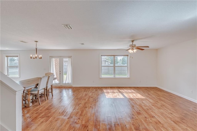 3473 Summer Woods Cir W, Mobile, AL 36695 - unfurnished room featuring healthy amount of natural light, a chandelier, and light wood-style floors