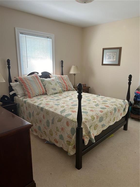 bedroom with light colored carpet