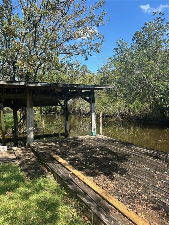 view of home's community featuring a deck with water view