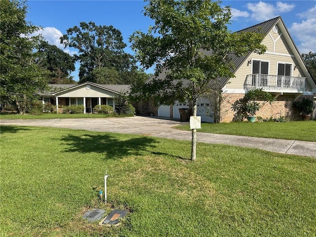 view of front of home with concrete driveway, an attached garage, a front yard, brick siding, and metal roof