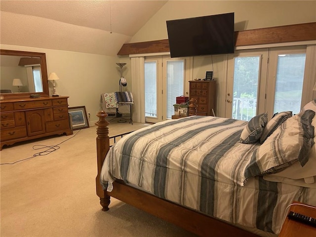 bedroom with access to exterior, light colored carpet, multiple windows, and vaulted ceiling