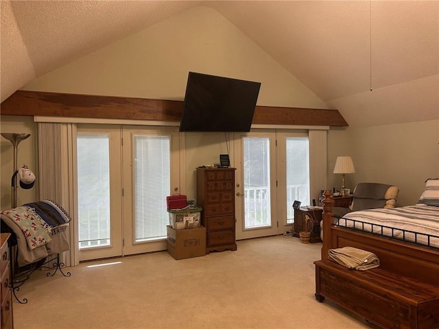 carpeted bedroom featuring lofted ceiling, a textured ceiling, and access to outside