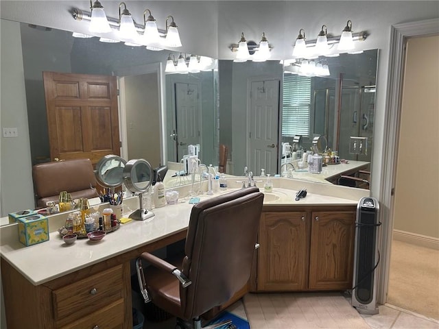 bathroom featuring a shower stall, tile patterned flooring, and vanity