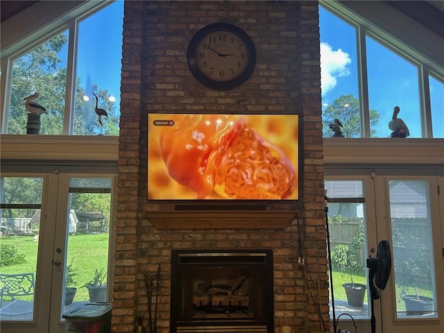 interior details featuring french doors and a fireplace