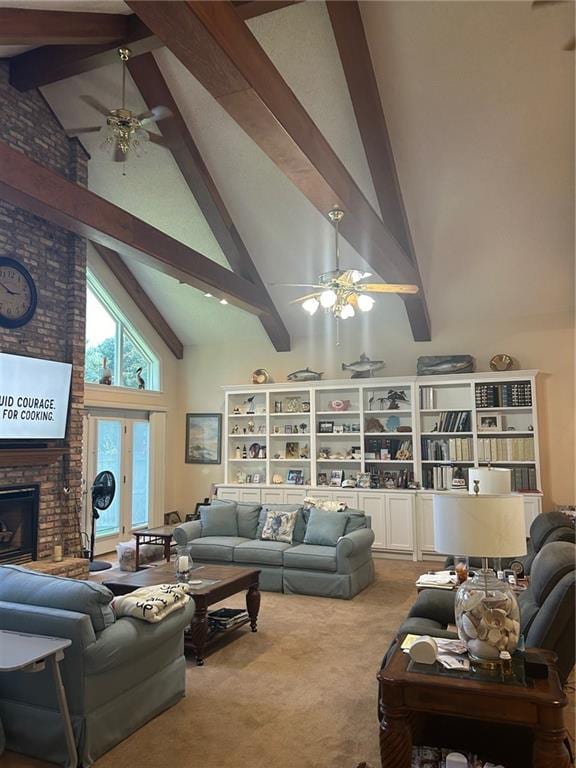 living room featuring ceiling fan, carpet flooring, beam ceiling, high vaulted ceiling, and a fireplace