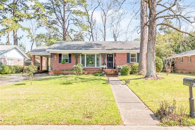 ranch-style house with brick siding and a front lawn