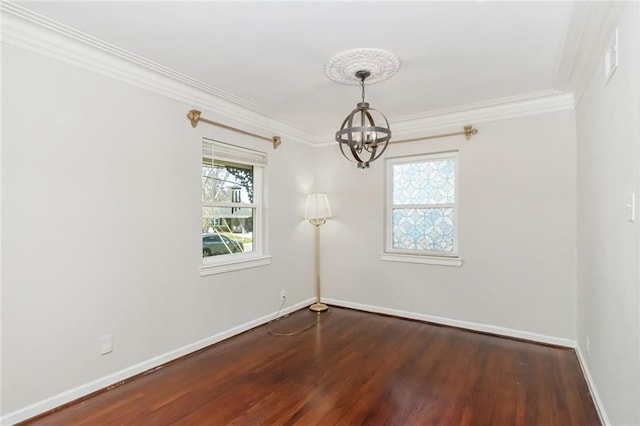 empty room with baseboards, a notable chandelier, ornamental molding, and dark wood-style flooring