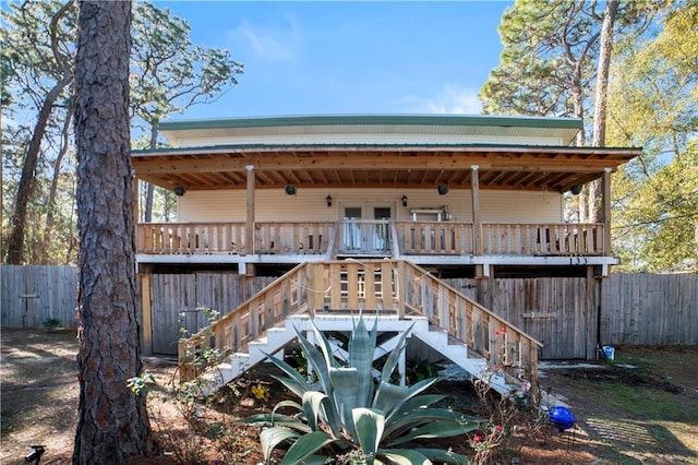 back of house featuring a deck