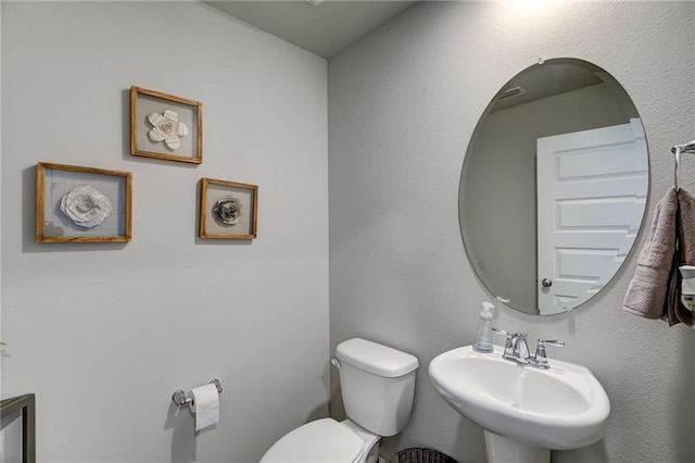 bathroom with sink and toilet