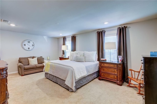 bedroom with light carpet