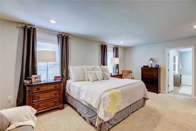 carpeted bedroom with ensuite bathroom