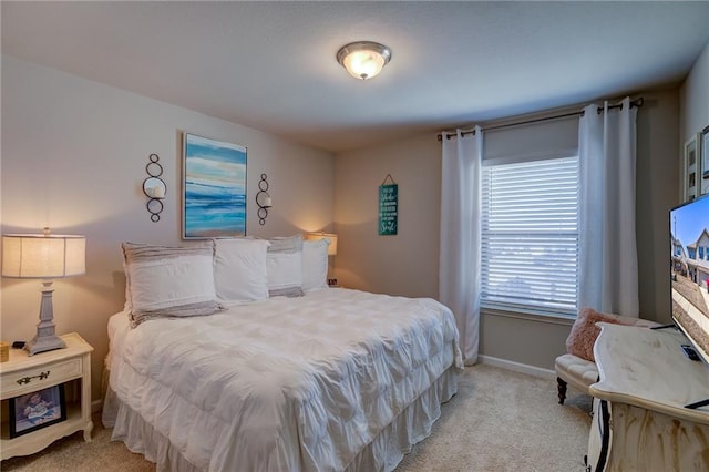 bedroom featuring light carpet