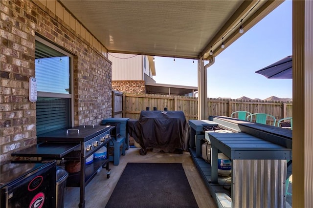 view of terrace with a grill