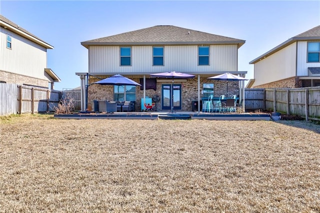 back of property with a patio area