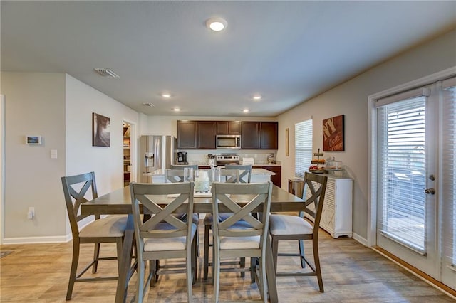 dining area with light hardwood / wood-style flooring