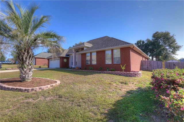 view of front facade featuring a front yard and a garage