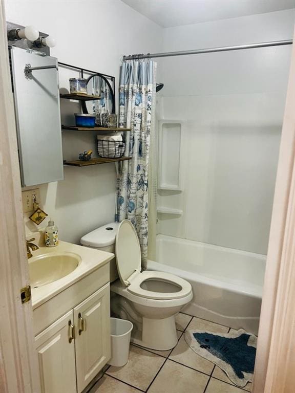 full bathroom featuring tile patterned flooring, vanity, toilet, and shower / tub combo