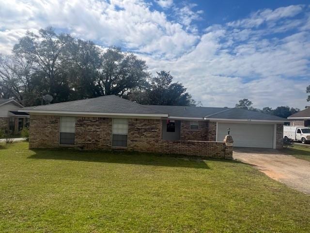 single story home featuring brick siding, an attached garage, driveway, and a front yard