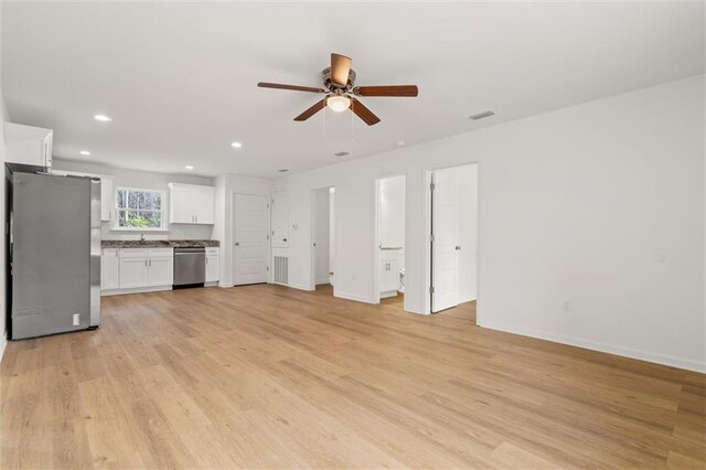 unfurnished living room with visible vents, ceiling fan, light wood-type flooring, and recessed lighting