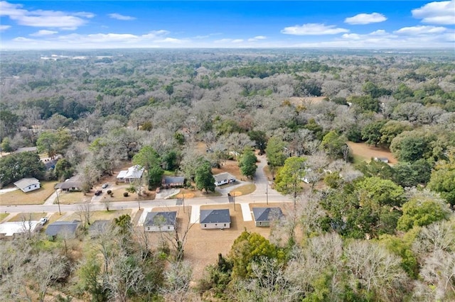 bird's eye view featuring a forest view