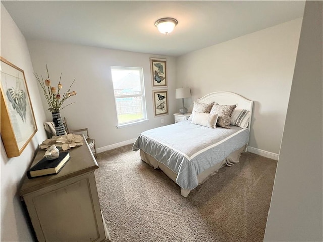 carpeted bedroom featuring baseboards