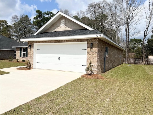 exterior space with a front lawn, an attached garage, brick siding, and concrete driveway