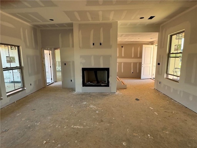 unfurnished living room featuring a fireplace